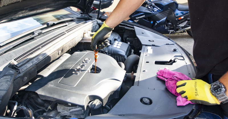 An image of a mechanic working on a car